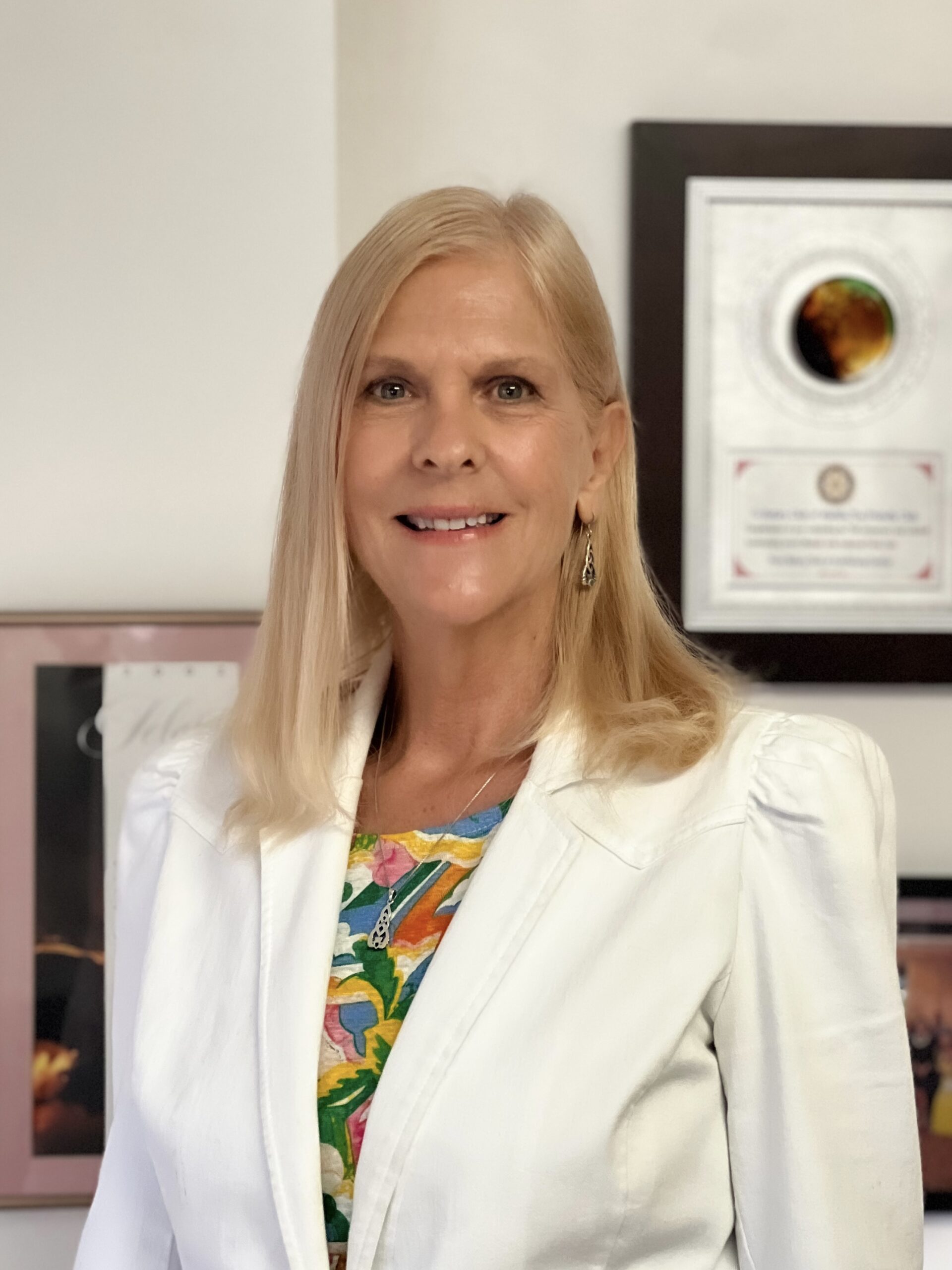 Janet M. Kelley, President and Treasurer of SME Honolulu, smiling in a professional indoor setting.